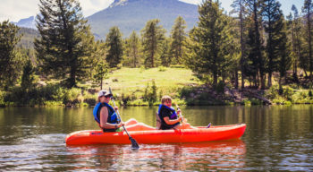 Two young women kayaking together.